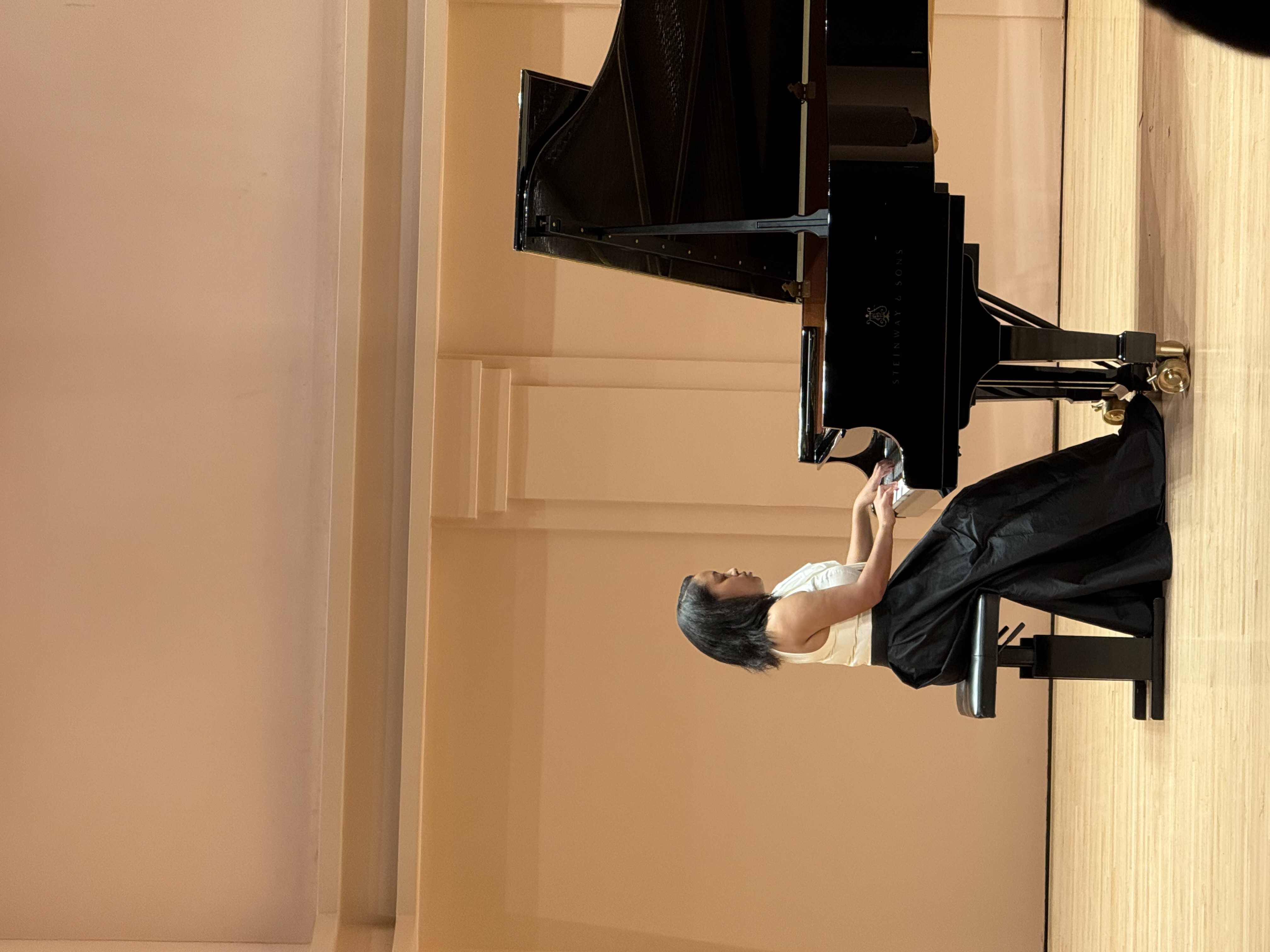 Ariel Abyssinia Workeneh, piano teacher with a student in the studio